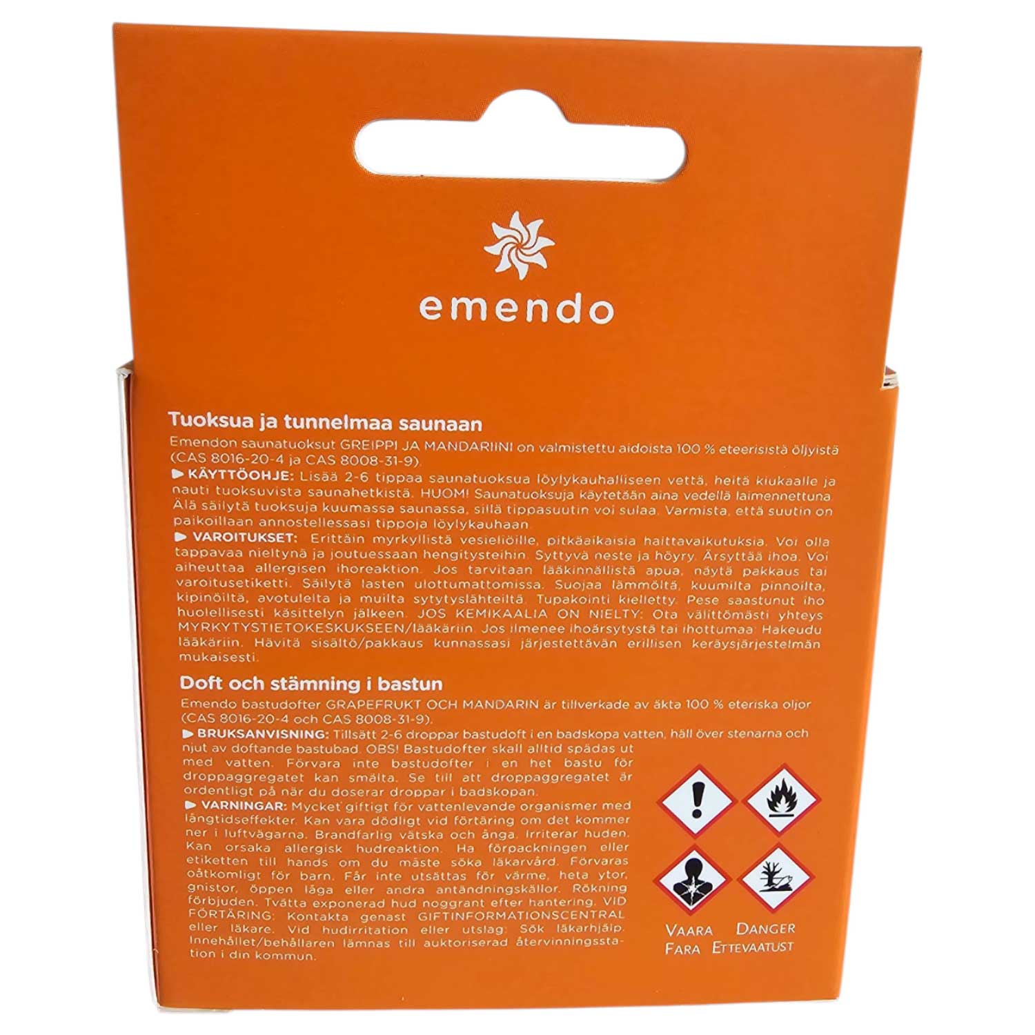 Orangefarbene Kartonverpackung für ätherische Saunaöle mit aufgedruckten Sicherheitshinweisen und Symbolen.